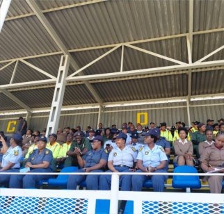 Police officers watching a sports event from the stands